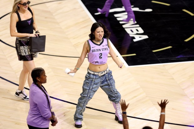 Oscar- and Grammy-winning artist Rei Ami, of "K-Pop Demon Hunters," throws t-shirts to fans in the third quarter of Game 2 of the WNBA semifinals game between the Golden State Valkyries and the Las Vegas Aces at Chase Center in San Francisco, Calif., on Wednesday, Oct. 7, 2026. (Ray Chavez/Bay Area News Group)