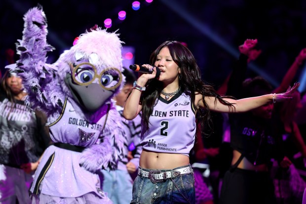 Golden State Valkyries macost, Violet, dances along with Oscar- and Grammy-winning artist Rei Ami, of "K-Pop Demon Hunters," during the halftime performance of Game 2 of the WNBA semifinals between the Golden State Valkyries and the Las Vegas Aces at Chase Center in San Francisco on Wednesday, Oct. 7, 2026. (Ray Chavez/Bay Area News Group)