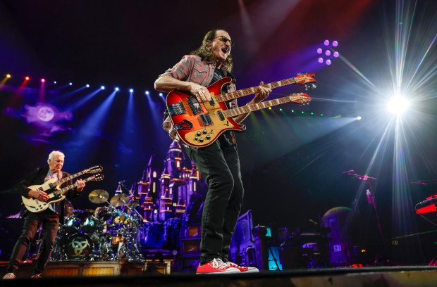 Rush's Geddy Lee, center, and Alex Lifeson perform during their "Fifty Something Tour" at the SAP Center in San Jose, Calif., on Thursday, Oct. 15, 2026. (Nhat V. Meyer/Bay Area News Group)