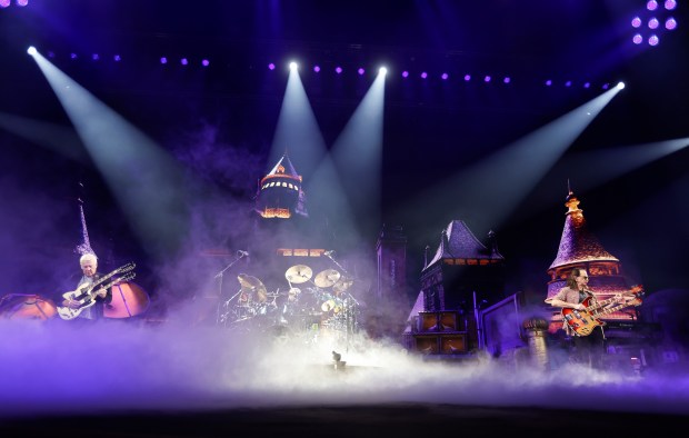 Rush's Alex Lifeson, far left, and Geddy Lee, far right, perform during their "Fifty Something Tour" at the SAP Center in San Jose, Calif., on Thursday, Oct. 15, 2026. (Nhat V. Meyer/Bay Area News Group)