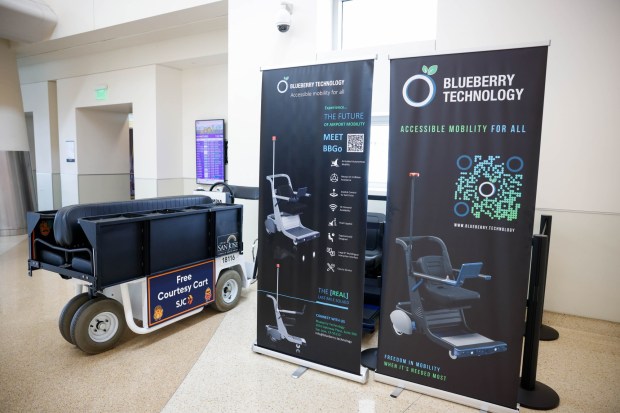 From left, a free courtesy cart and two of Blueberry Technology's BBGo artificial intelligence-powered self-driving vehicles, built to help elderly or disabled passengers navigate airport terminals, at San Jose Mineta International Airport in San Jose, Calif., on Thursday, Sept. 17, 2026. (Shae Hammond/Bay Area News Group)