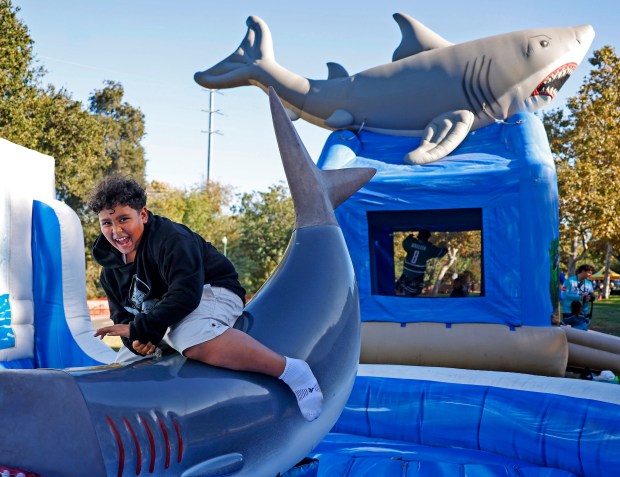 Jaiden Alvarez, 10, from San Jose, rides a shark ride during opening day festivities at the SAP Center in San Jose, Calif., on Thursday, Oct. 1, 2026. (Nhat V. Meyer/Bay Area News Group)