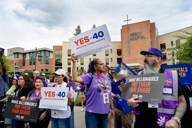 Hundreds of healthcare workers rally outside Dignity Health Mercy General Hospital in Sacramento, Calif., on Aug. 28, 2026, in support of Proposition 40, which would levy a one-time tax on California billionaires. (Renée C. Byer/The Sacramento Bee/TNS)
