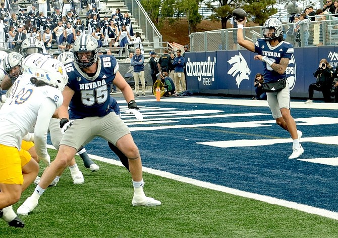 Led by quarterback Carter Jones, right, the Nevada offense controlled the ball for more than 37 minutes and trounced San Jose State, 55-10, at Mackay Stadium last season.