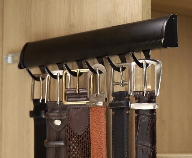 A pull-out rack from California Closets also tidies hanging belts in a slim profile. (California Closets)