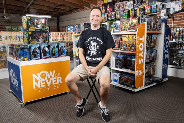 Aaron Trites poses inside Now or Never Comics in downtown San Diego on Aug. 4, 2026. Trites, 44, is originally from Boston where he worked at a comic shop for ten years after graduating high school. "I've known since I was 18 that I was going to own a comic shop," said Trites. After moving to San Diego with his wife, Trites found this downtown space and has now been running the store for over seven years. Trites favorite comic series is "The Avengers."