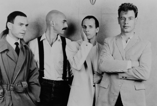 The members of King Crimson, circa 1981. Shown from left are guitarist Robert Fripp, bassist and Chapman Stick player Tony Levin, guitarist and singer Adrian Belew, and drummer Bill Bruford. (Warner Bros. Records)