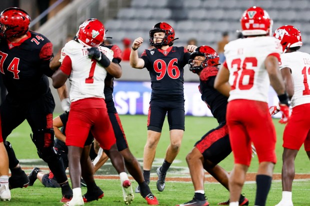 San Diego State kicker Cooper DiLeva watches field goal go through uprights against Fresno State at Snapdragon Stadium. (Meg McLaughlin / The San Diego Union-Tribune)