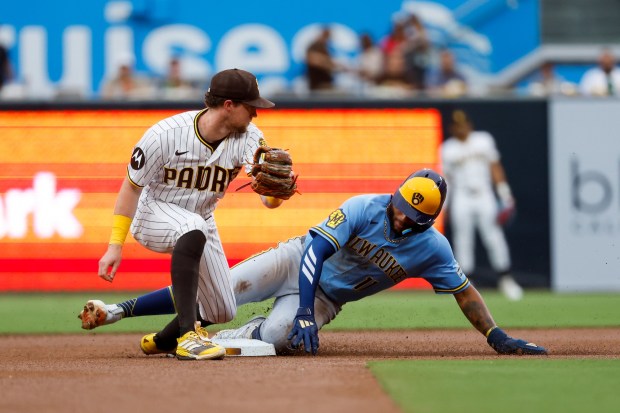 Jackson Chourio #11 of the Milwaukee Brewers steals second base against Jake Cronenworth #9 of the San Diego Padres during the first inning at Petco Park on Monday, Aug. 10, 2026 in San Diego, California. (Meg McLaughlin / The San Diego Union-Tribune)