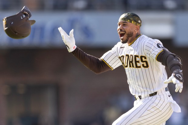 The Padres' Luis Campusano celebrates after hitting a walkoff single in the 11th inning Wednesday against the Brewers. (Luke Johnson / The San Diego Union-Tribune)
