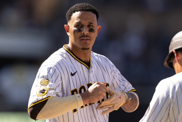 Padres third baseman Manny Machado takes off his batting gloves after committing the final out in an inning during a game against the Milwaukee Brewers Wednesday, Aug. 12, 2026, at Petco Park in San Diego, CA. (Luke Johnson / The San Diego Union-Tribune)