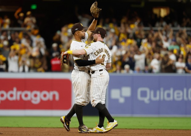 Xander Bogaerts and Jake Cronenworth of the San Diego Padres celebrate after a win against the Chicago Cubs during Game 2 of the National League Wild Card Series at Petco Park on September 30, 2026 in San Diego, CA. (K.C. Alfred / The San Diego Union-Tribune)