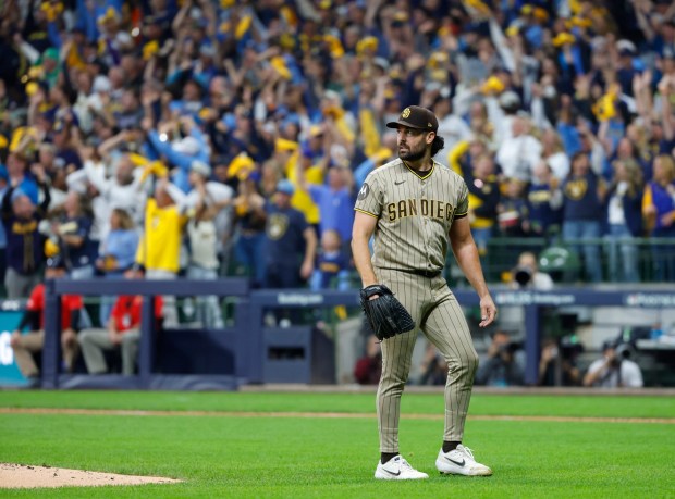 Robbie Ray of the San Diego Padres watches a two-run home run by Jackson Chourio in the third inning of Saturday's NL Division Series loss to the Brewers in Milwaukee. (K.C. Alfred / The San Diego Union-Tribune)