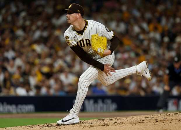 Walker Buehler throws during the first inning of Wednesday's playoff game at Petco Park. (K.C. Alfred / The San Diego Union-Tribune)