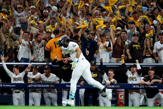 Fernando Tatis Jr. and teammates celebrate after his home run against the Milwaukee Brewers during the third inning in Game 4 of the National League Division Series at Petco Park on Wednesday, Oct. 7, 2026 in San Diego, California. (Meg McLaughlin / The San Diego Union-Tribune)
