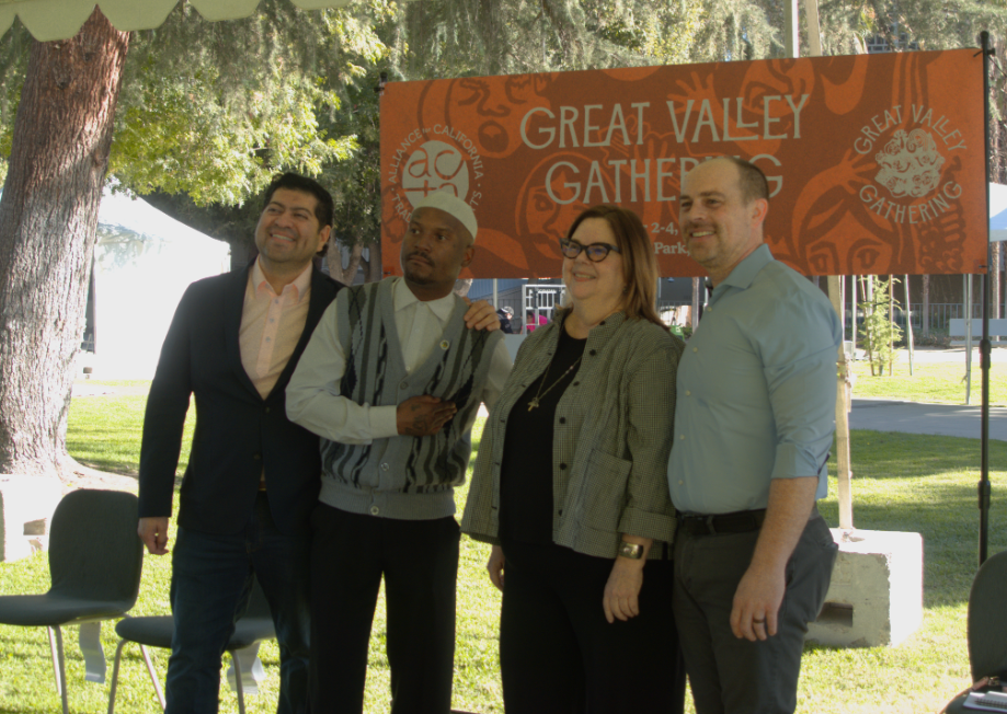Speakers (left to right, District 3 Supervisor Luis Chavez, rap artist Fashawn, Festival Director Amy Kitchener, CEO of Downtown Fresno Partnership Elliott Balch) for the Great Valley Gathering Press Conference pose for a picture at Courthouse Park on Sept. 30.