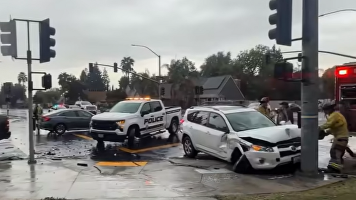 Three cars crash at Clovis intersection amid rainstorm.