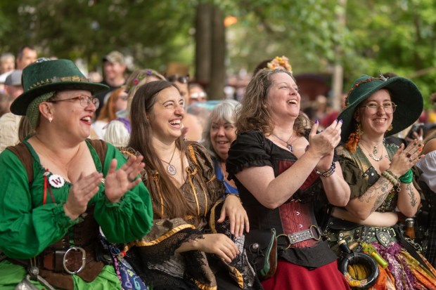 happy people in 16th Century costumes