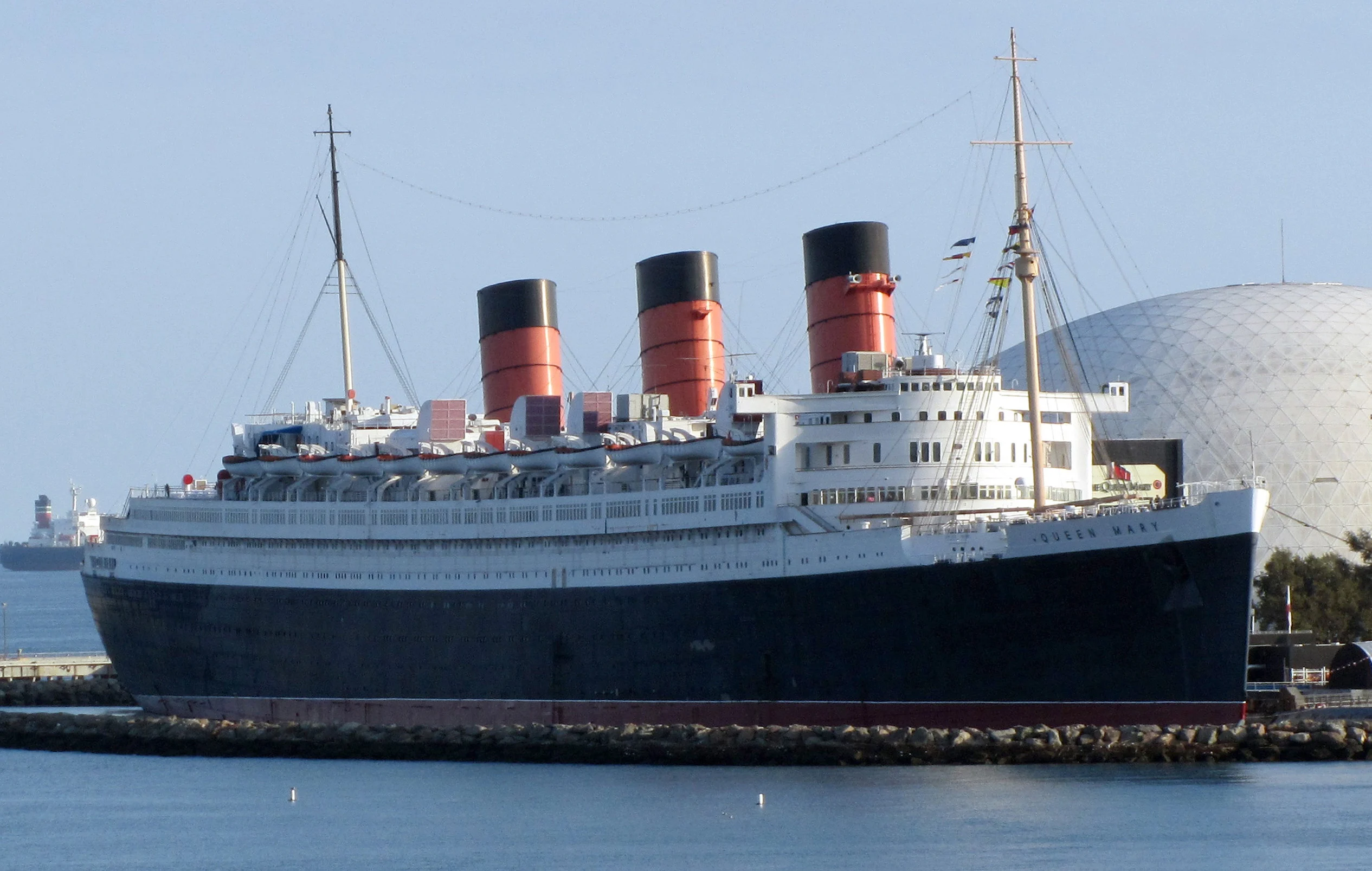 The Queen Mary docked at Long Beach, California, named to the 2026 Top 25 Most Haunted Historic Hotels list