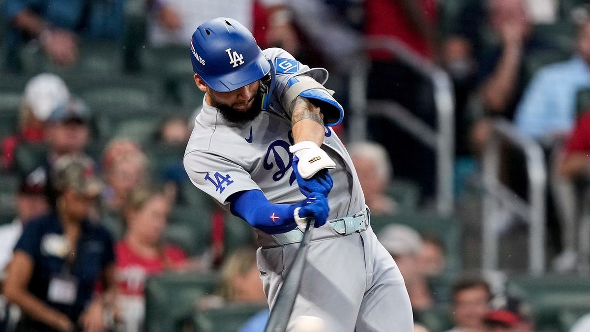 Andy Pages swings during Game 3 of the National League Division Series against the Atlanta Braves.