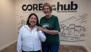 Veda Ashby Romero, left, a disaster case manager for CORE, poses for a portrait with Mary Landau, a fire survivor, at the CORE resource center on Thursday, Oct. 15, 2026, in Altadena, Calif. (AP Photo/Jill Connelly)