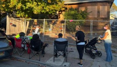 Supporters continue to gather outside the home of Zakiya Jendayi a week after sheriff’s deputies boarded up doors and windows, changed the locks and fenced off the property. Photo by Lindsay Imai Hong.