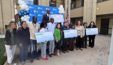 Assemblywoman Esmeralda Soria and community leaders pose with ceremonial checks announcing state funding for food assistance and senior meal programs in Fresno County.