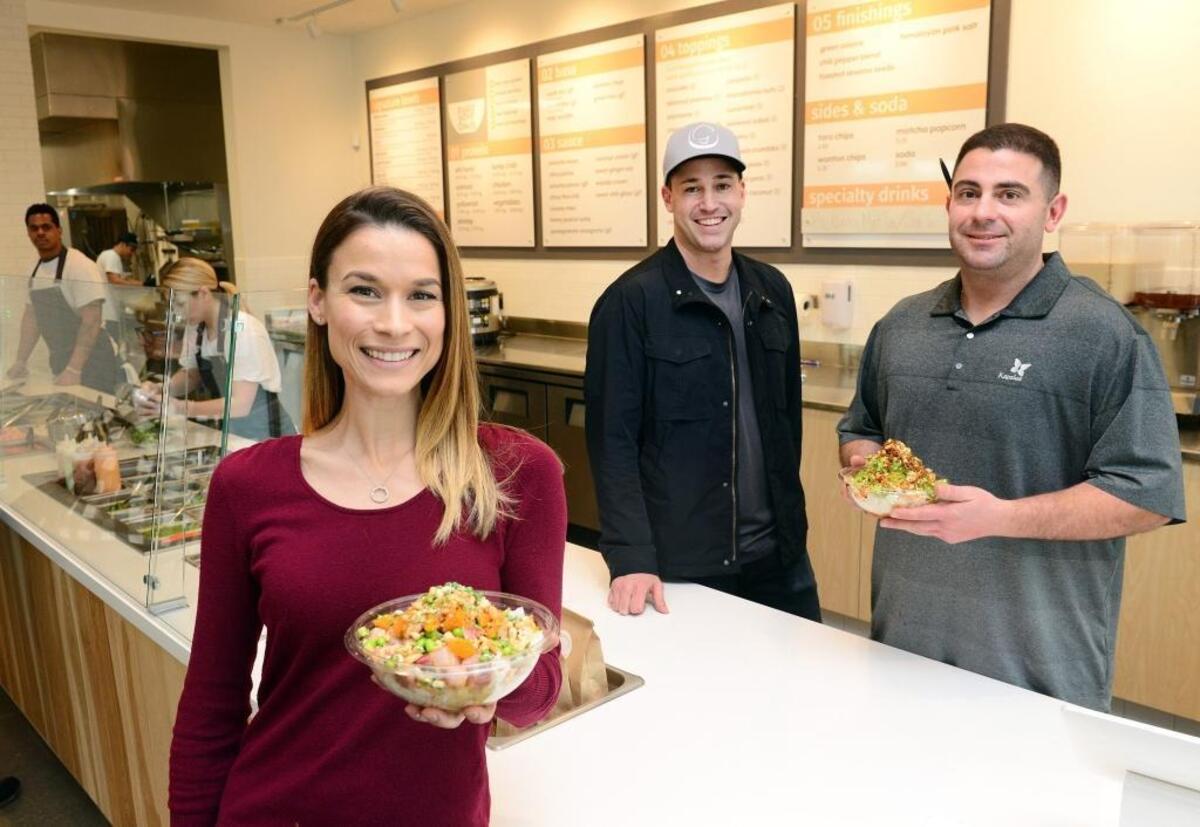 Owners Rema Koligian and Brandon Smittcamp and chef James Boone are pictured in this file photo from 2017 when they opened Butterfish California Poke in north Fresno. The restaurant offers fresh and healthy poke bowls with customizable menu options.