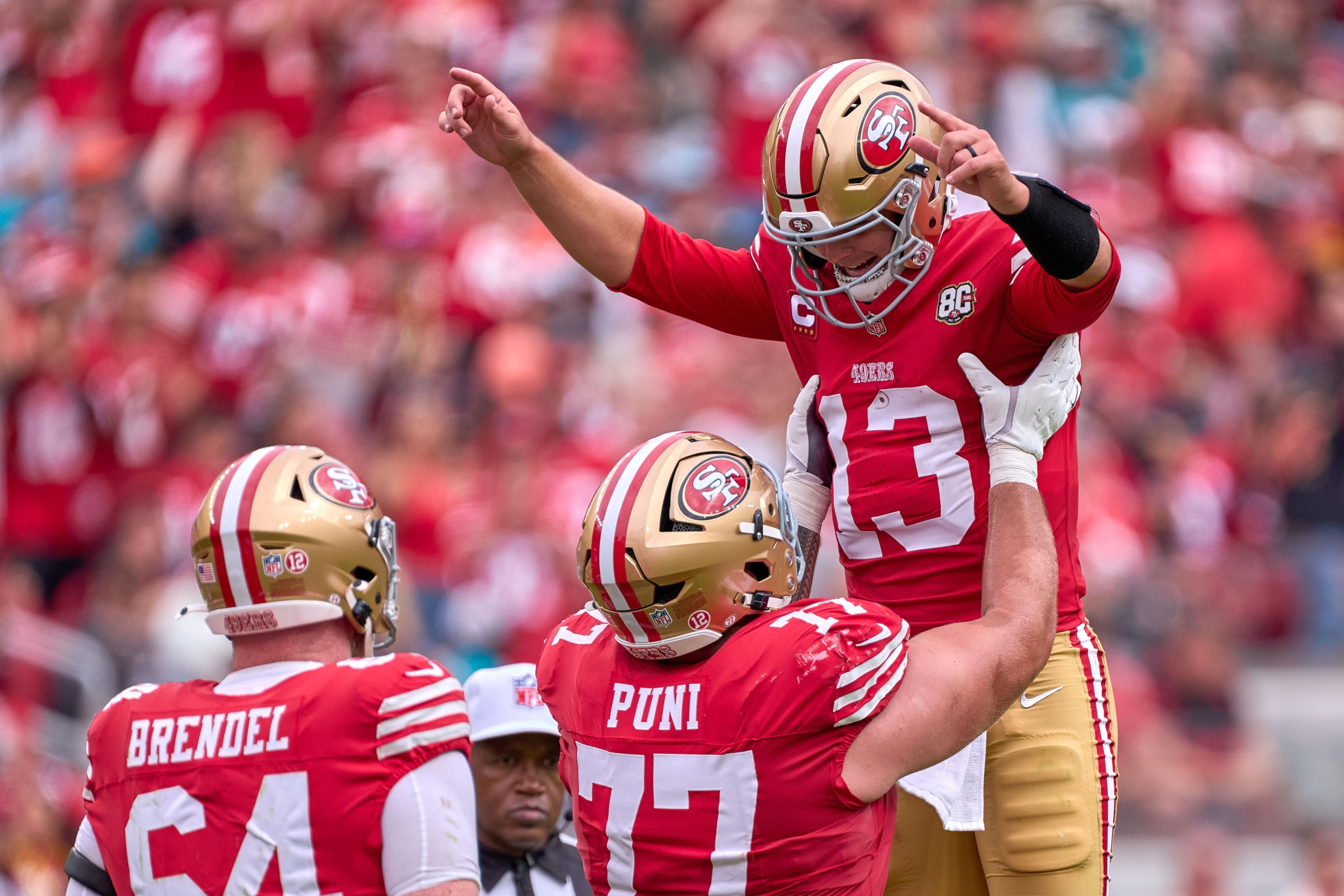 SANTA CLARA, CA - SEPTEMBER 20: Quarterback Brock Purdy (13) of the San Francisco 49ers celebrates with teammates after a touchdown play against the Miami Dolphins during a game at Levi’s Stadium on September 20, 2026 in Santa Clara, California. (Photo by Robin Alam/Icon Sportswire via Getty Images)