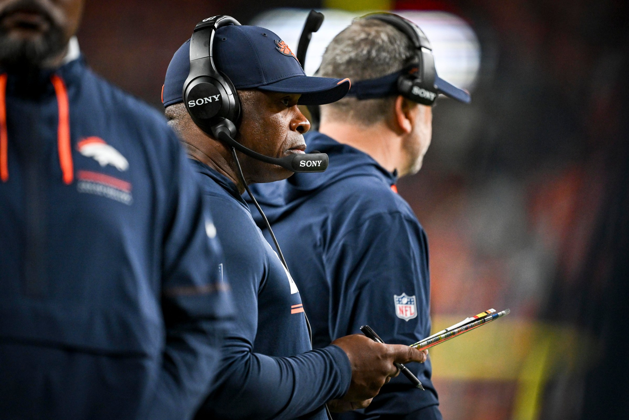 DENVER , CO - SEPTEMBER 27: Defensive coordinator Vance Joseph of the Denver Broncos dials it up during the fourth quarter of the Broncos’ 30-26 win over the Los Angeles Rams at Empower Field at Mile High in Denver, Colorado on Sunday, September 27, 2026. (Photo by AAron Ontiveroz/The Denver Post)