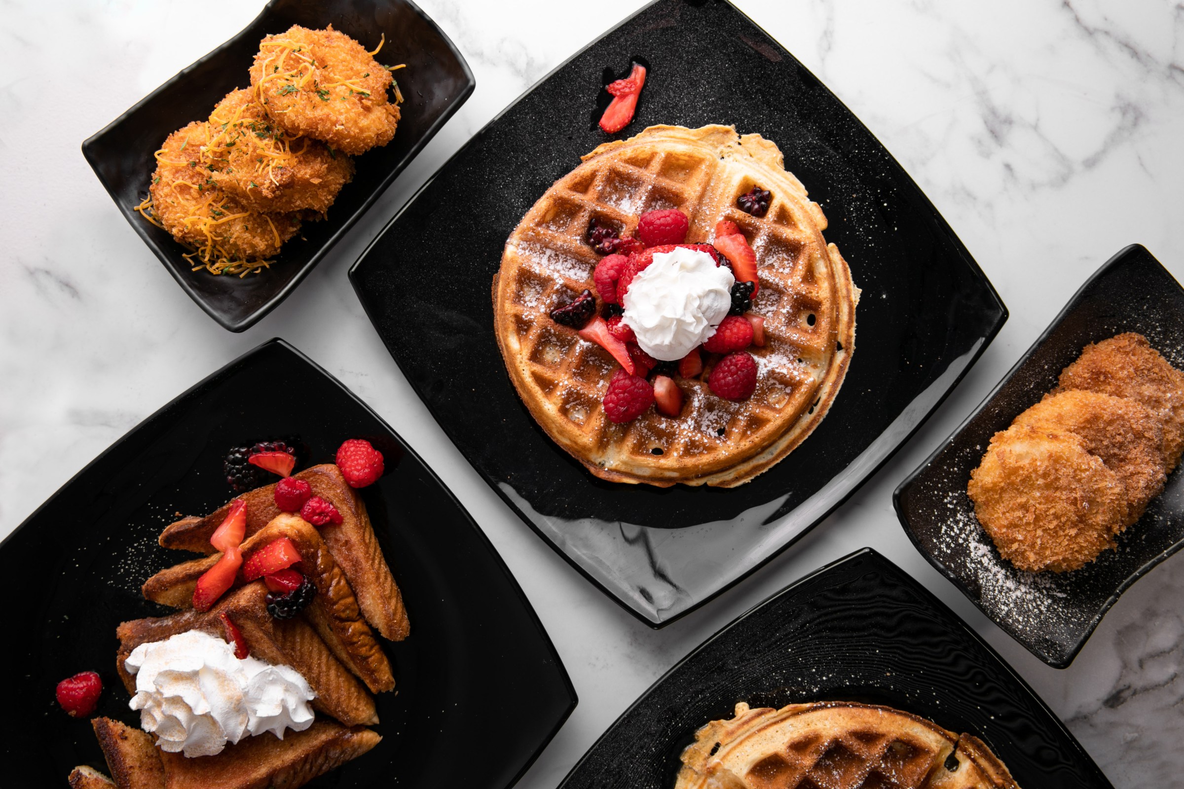 An assortment of dishes from Gritz & Wafflez restaurant in Los Angeles, California.