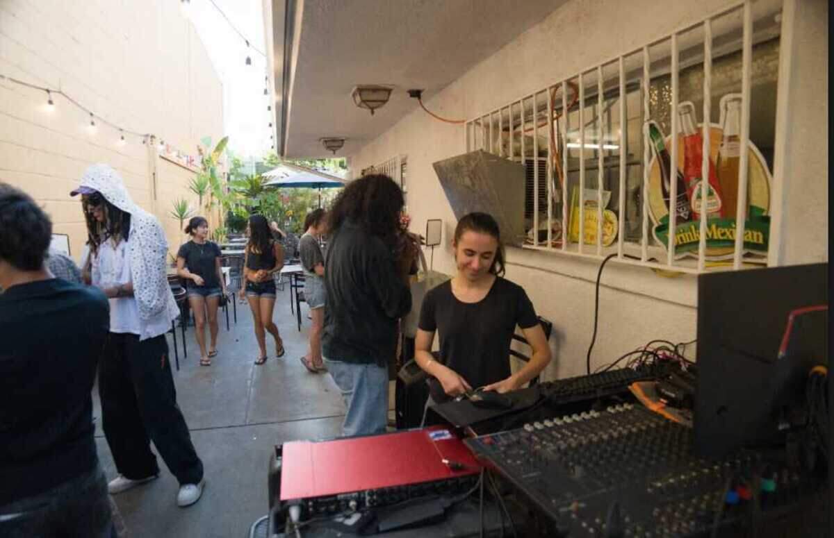 At Jalapeños in midtown, a sound engineer works the mixing board during a Live Line Sac performance on the restaurant’s 21st Street patio. The music series moved to Jalapeños after an August fire damaged the Red Barn artist collective’s space at the Folsom Flea Market.