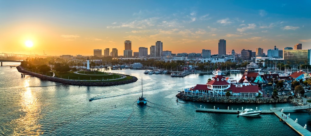 Golden sunset over the harbor, marina, and skyline of Long Beach, California.