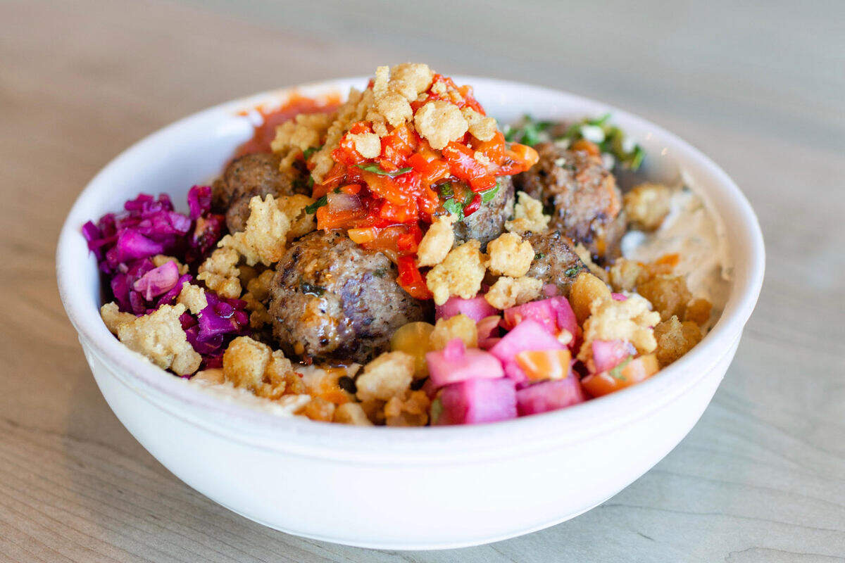 A custom bowl with Moroccan lamb meatballs is pictured in this handout photo from Mayd Modern Mediterranean.