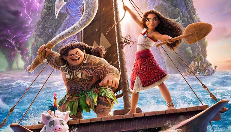 Promotional image for Moana 2 featuring Moana holding an oar on a wooden canoe alongside Maui, who holds his giant fishhook, with animal sidekicks Heihei and Pua on deck.