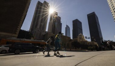 The sun shines over the financial district towers of downtown Los Angeles as Southern California is hit by a heatwave Friday, Sept. 6, 2024, in Los Angeles. (AP Photo/Etienne Laurent)