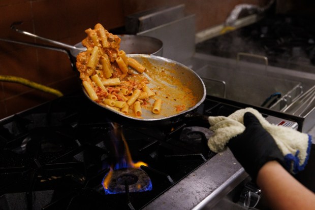 Rigatoni salsiccia being prepared at Barbusa in Little Italy. (Kristian Carreon / The San Diego Union-Tribune)