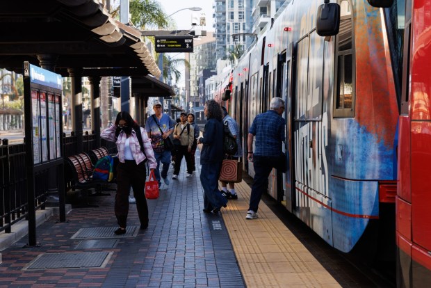 San Diego, California - Riders get on and off the trolley at the Santa Fe Depot in downtown San Diego on Thursday, Oct. 1, 2026. (Kristian Carreon / The San Diego Union-Tribune)