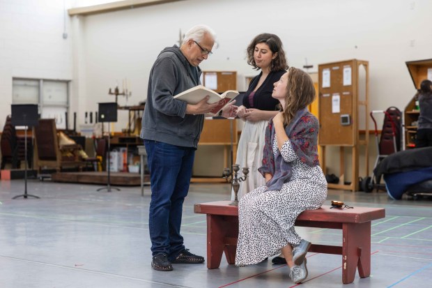 Director Christopher Mattaliano rehearses with Emily Weinberg, center, and Madison Leonard for San Diego Opera's upcoming production of Verdi's "Rigoletto." (Zoë Meyers / For The San Diego Union-Tribune)