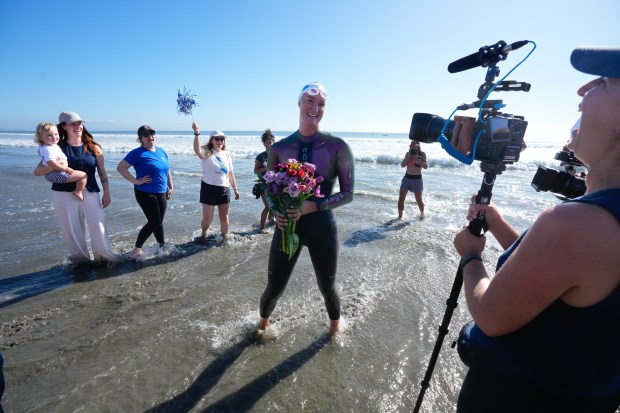Catherine Breed, 33 from Marin County, reaches the beach at Coronado on Monday, Oct. 19, 2026, in Coronado, CA. Breed began her swim from Brookings, Oregon, to the Mexico border, taking 111 days from the start until Monday, October 19th, and completing nearly 900 miles. (Nelvin C. Cepeda / The San Diego Union-Tribune)