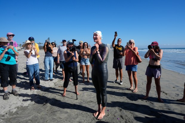 Catherine Breed, 33 from Marin County, reaches the beach at Coronado on Monday, Oct. 19, 2026, in Coronado, CA. Breed began her swim from Brookings, Oregon, to the Mexico border, taking 111 days from the start until Monday, October 19th, and completing nearly 900 miles. (Nelvin C. Cepeda / The San Diego Union-Tribune)