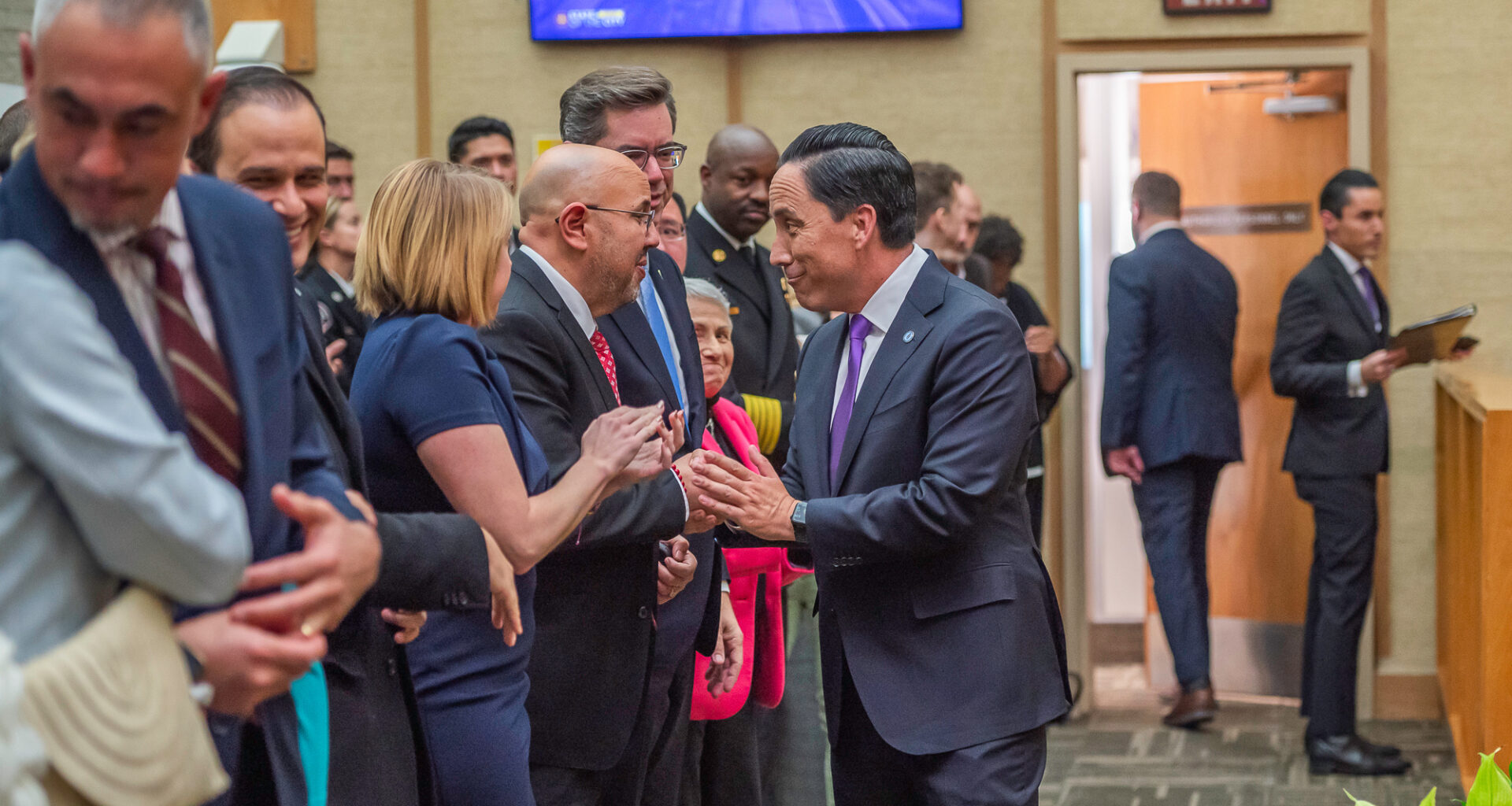 San Diego Mayor Todd Gloria shakes hands with Councilmember Henry L. Foster III after delivering his State of the City speech on Wednesday, Jan. 15, 2025. / Photo by Vito di Stefano for Voice of San Diego