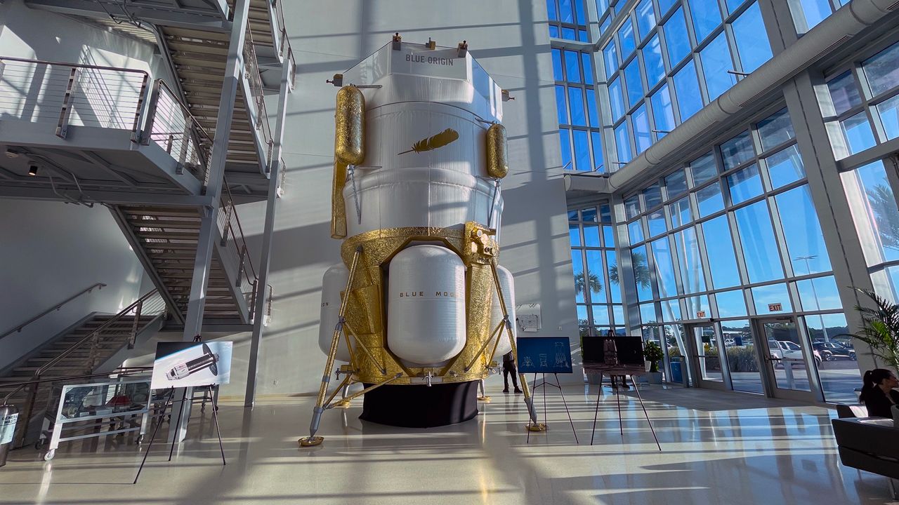 This is a replica of Blue Origin's Blue Moon lunar lander that will send humans back to the moon in a future Artemis mission. NASA acting administrator Sean Duffy announced that he is opening up contracts for the Artemis III mission because SpaceX is behind schedule with its Starship. He mentioned Blue Origin as one of the companies that could replace SpaceX on the mission. (Spectrum News/Anthony Leone)
