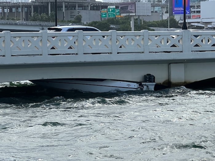 Small boat pushed under Venetian Bridge in Miami