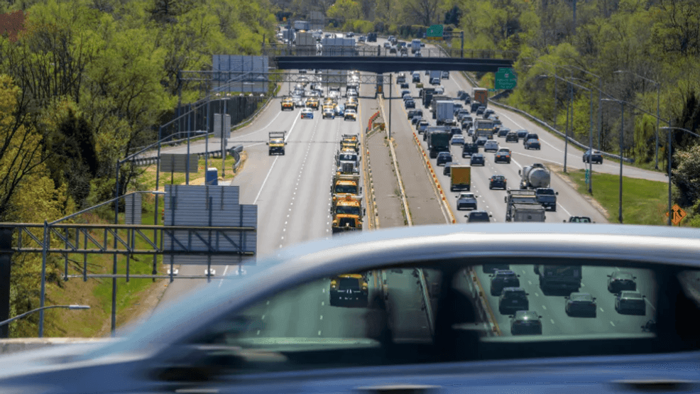 In this file photo, in a view from the top of the Interstate 70/I-695 interchange, a car in foreground passes above some of the 350 construction vehicles. (Baltimore Sun)