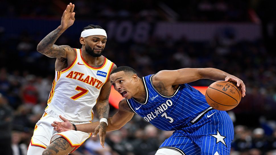 Orlando Magic guard Desmond Bane (3) is defended by Atlanta Hawks guard Nickeil Alexander-Walker (7) during the second half of an NBA basketball game, Friday, Oct. 24, 2025, in Orlando, Fla.