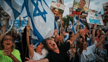 People gather at a plaza known as Hostages Square in Tel Aviv, Israel, Monday, Oct. 13, 2025 prior to the release of Israeli hostages held in Gaza. (AP Photo/Emilio Morenatti)