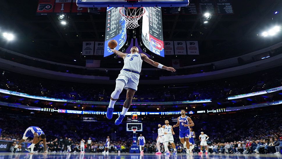 Orlando Magic's Paolo Banchero goes up for a dunk during the second half of an NBA basketball game against the Philadelphia 76ers Monday, Oct. 27, 2025, in Philadelphia. (AP Photo/Matt Slocum)