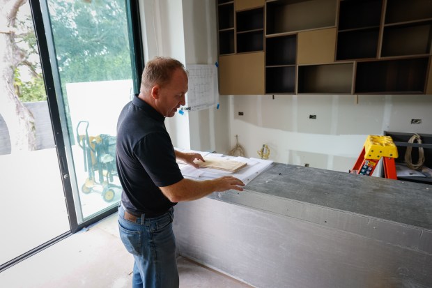 Alair Homes Orlando project manager Daniel Kennerly points out details...