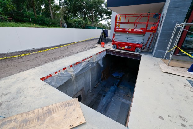 The opening for the car elevator will lower the owner’s...